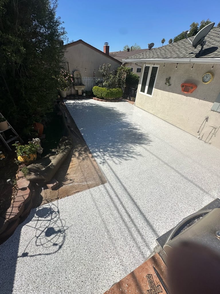Coated concrete patio and walkway by Cozy Coatings