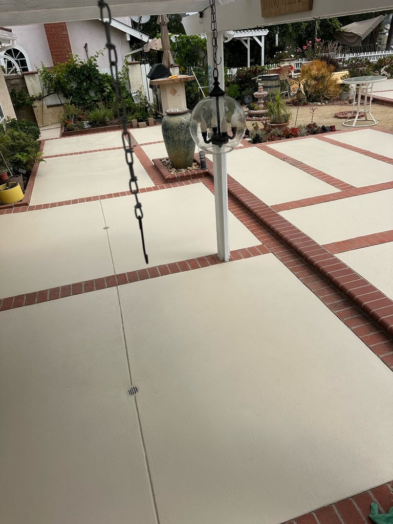 Smooth acrylic sealer finish on a backyard patio